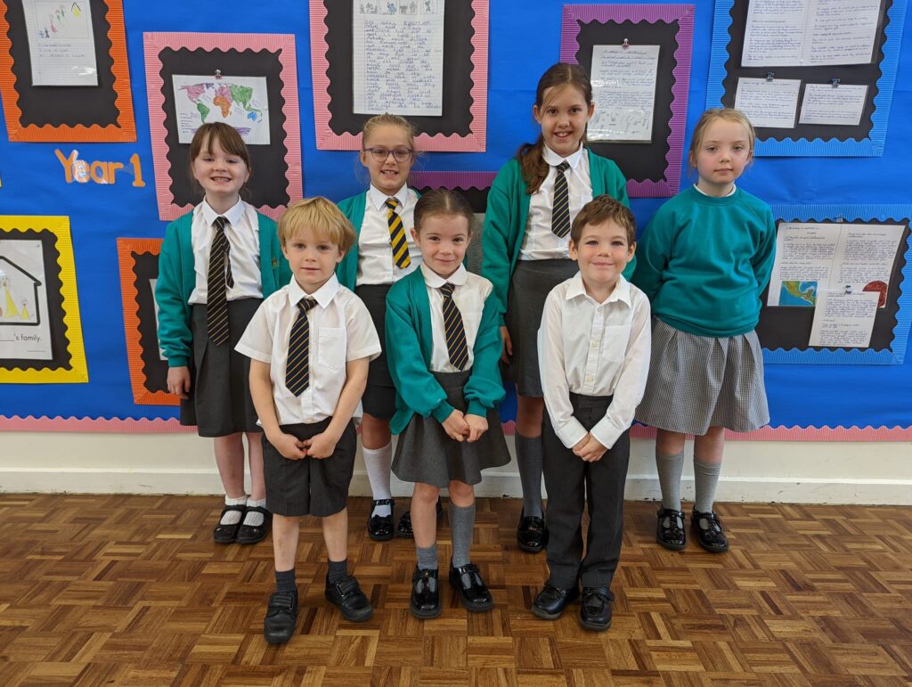 Photo showing winners of the Horsmonden Hero award holding up their certificates and smiling for the camera.