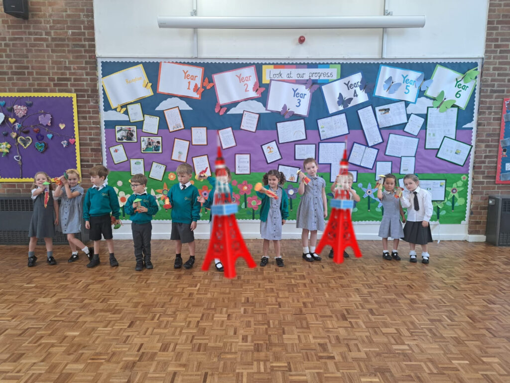 Year 1 pupils are pictured making their own Rockets in order to bring their Maths lesson to life!
