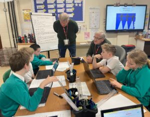 Members of the Horsmonden Nostalgia Society are pictured sharing their collection of WWII memorabilia, as well as their perspectives on the war with some Horsmonden students.
