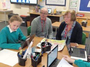 Members of the Horsmonden Nostalgia Society are pictured sharing their collection of WWII memorabilia, as well as their perspectives on the war with some Horsmonden students.