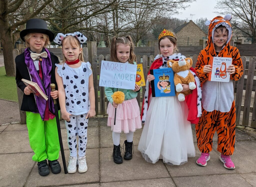 Five students are pictured dressed up as well-known characters from books for World Book Day 2024.