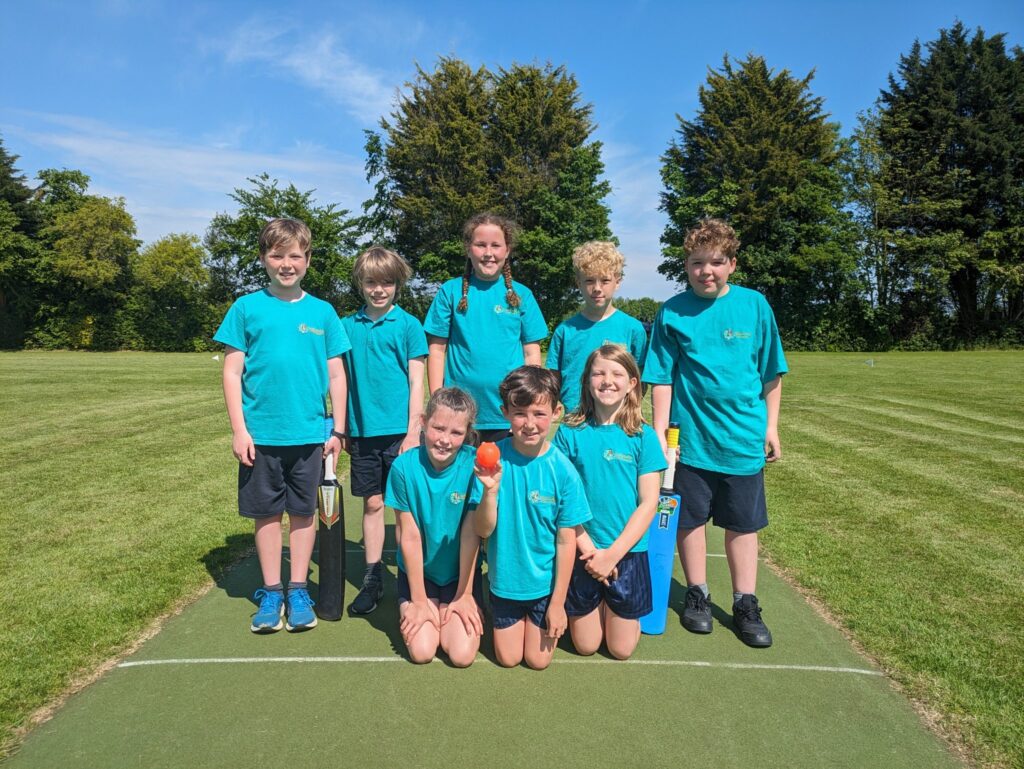 A group of seven Horsmonden pupils from the academy's Cricket Team are pictured posing for the camera, after having won two games at the Wealden Schools Partnership Cricket Tournament, held at Dulwich School.