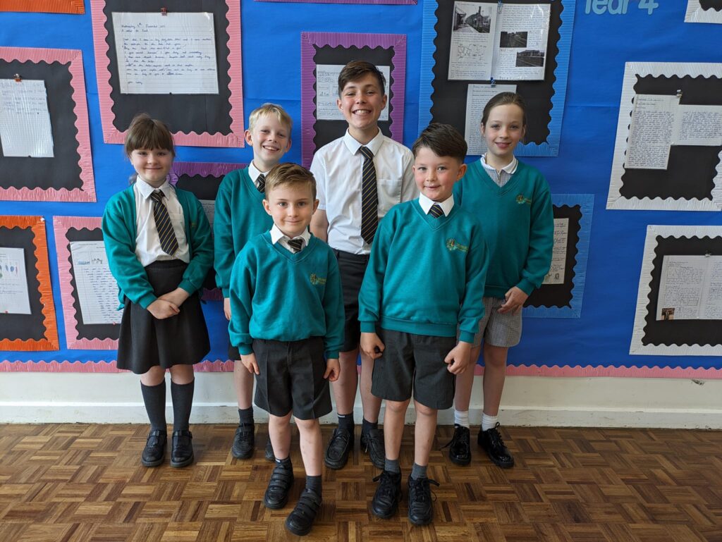 Photo showing winners of the Horsmonden Hero award smiling for the camera.