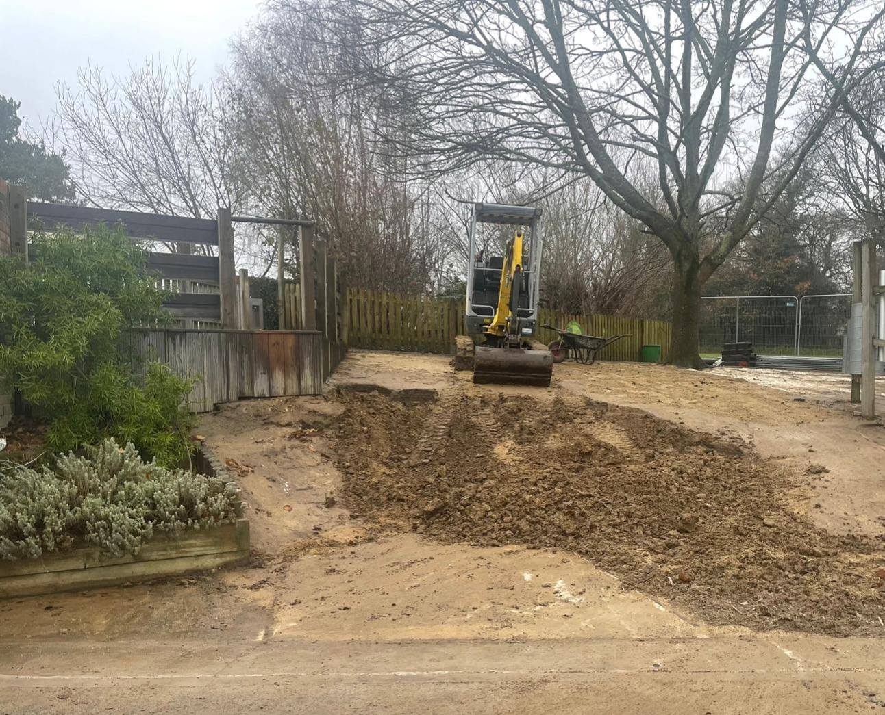 A digger on a mound of dirt