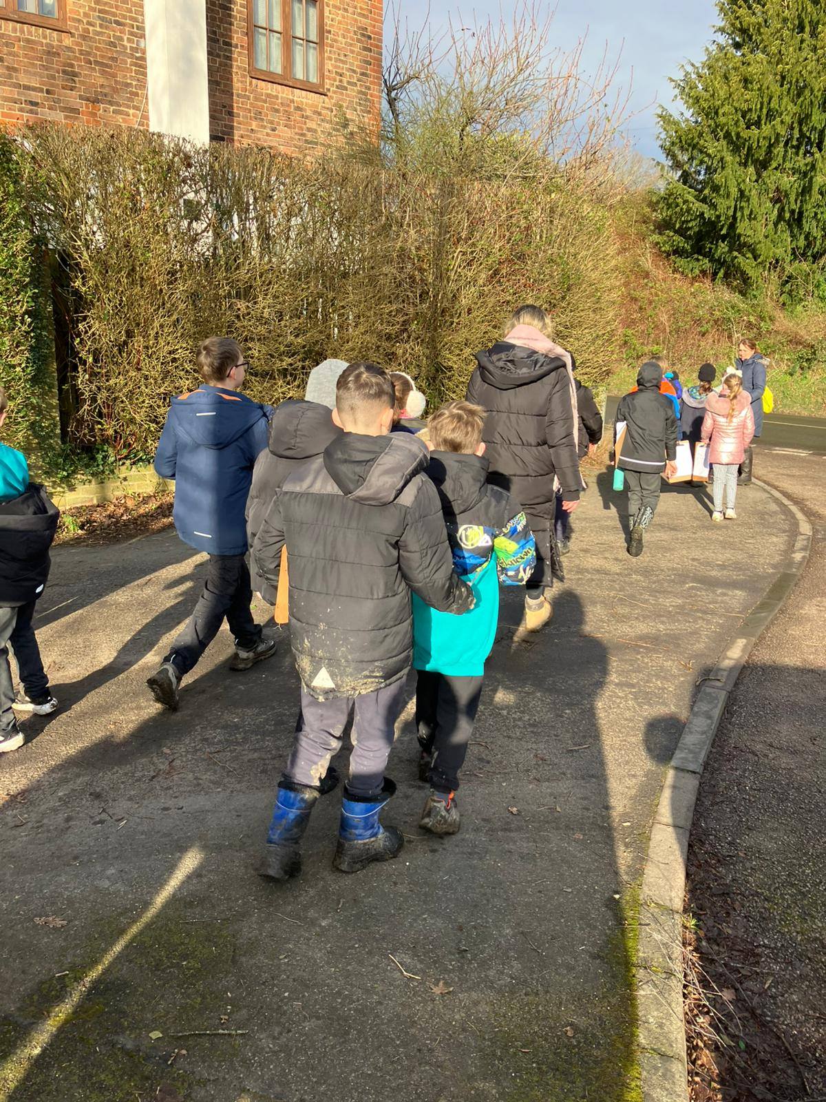 A group of students walking along a path